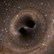 Computer simulation of two black holes merging into one. Image: The SXS (Simulating eXtreme Spacetimes) Project